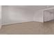 Large, empty living room with tile flooring and recessed lighting, offering a blank canvas for customization at 40499 W Michaels Dr, Maricopa, AZ 85138