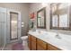 The bathroom features double sinks and a door to the backyard at 42266 W Sparks Dr, Maricopa, AZ 85138