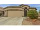Well-maintained single-story home featuring a two-car garage at 42266 W Sparks Dr, Maricopa, AZ 85138