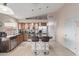 Kitchen featuring tile flooring, and an island with barstool seating at 42266 W Sparks Dr, Maricopa, AZ 85138