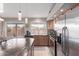 Well-lit kitchen boasts stainless steel appliances, stylish pendant lighting, and a functional island at 42266 W Sparks Dr, Maricopa, AZ 85138