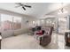 Cozy living room with a ceiling fan and bright natural light at 42266 W Sparks Dr, Maricopa, AZ 85138