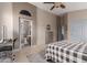 This main bedroom features a glimpse into the connected bathroom and walk in closet at 42266 W Sparks Dr, Maricopa, AZ 85138