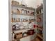 Organized pantry with ample shelving providing tons of storage at 42266 W Sparks Dr, Maricopa, AZ 85138