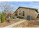 The side yard features a neutral color scheme, desert landscaping, and walkway leading to the backyard at 42266 W Sparks Dr, Maricopa, AZ 85138