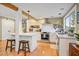 Modern kitchen featuring an island bar with seating, stainless appliances, and open layout at 4746 W Columbine Dr, Glendale, AZ 85304