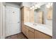 Bright bathroom features a vanity with storage, a large mirror and great lighting at 5303 N 7Th St # 109, Phoenix, AZ 85014