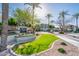 Welcoming entrance to community featuring lush landscaping and clear signage at 5303 N 7Th St # 109, Phoenix, AZ 85014