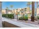 Enjoy the community pool, surrounded by lush landscaping and palm trees, within a gated community at 5303 N 7Th St # 109, Phoenix, AZ 85014
