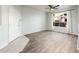 Bright and open living room with hardwood floors and a large window showcasing natural light at 5303 N 7Th St # 109, Phoenix, AZ 85014