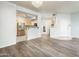 Spacious living room showcasing an open layout with stainless steel appliances in the kitchen at 5303 N 7Th St # 109, Phoenix, AZ 85014