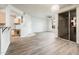 Inviting living room adjacent to the kitchen, featuring sliding glass doors and neutral decor at 5303 N 7Th St # 109, Phoenix, AZ 85014