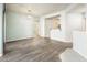 Bright living room with wood flooring, modern light fixture and an open floor plan at 5303 N 7Th St # 109, Phoenix, AZ 85014