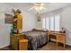 Bedroom featuring built-in shelving and wooden desk at 5415 E Mckellips Rd # 24, Mesa, AZ 85215