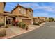Charming townhome with desert landscaping, covered entryway, and attached two-car garage in a well-maintained community at 5415 E Mckellips Rd # 24, Mesa, AZ 85215
