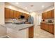 Well-lit kitchen featuring stainless steel appliances and gray countertops with an island at 5415 E Mckellips Rd # 24, Mesa, AZ 85215