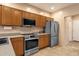 Kitchen featuring stainless steel appliances and wood cabinets with a tile floor at 5415 E Mckellips Rd # 24, Mesa, AZ 85215