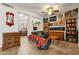 Eclectic living room showcasing art, bookshelves, and comfortable seating with ceiling fan at 5415 E Mckellips Rd # 24, Mesa, AZ 85215