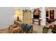 Bright living room featuring a high ceiling, neutral walls, tile floors, and a decorative cube shelving unit with string lights at 5415 E Mckellips Rd # 24, Mesa, AZ 85215