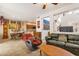 Open-concept living room with tile floors, a dining area, and a comfortable seating area, perfect for entertaining and relaxing at 5415 E Mckellips Rd # 24, Mesa, AZ 85215