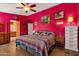 Spacious main bedroom boasting vibrant walls, wood floors, ceiling fan, and comfortable furnishings at 5415 E Mckellips Rd # 24, Mesa, AZ 85215