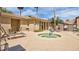Community hot tub and seating area with desert landscaping and sunny skies at 5415 E Mckellips Rd # 24, Mesa, AZ 85215