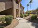 Charming condo featuring a well-maintained exterior, landscaped grounds, and inviting walkway at 5450 E Mclellan Rd # 131, Mesa, AZ 85205