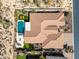 Aerial view of a tile roof home with a backyard pool, outdoor kitchen, and desert landscaping at 5810 E Calle Marita E --, Cave Creek, AZ 85331