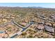 Expansive aerial view of a desert community featuring homes with pools and beautiful mountain views in the distance at 5810 E Calle Marita E --, Cave Creek, AZ 85331