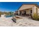 Expansive backyard with travertine patio, pool, firepit, and outdoor living spaces, perfect for entertaining at 5810 E Calle Marita E --, Cave Creek, AZ 85331