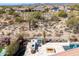 Aerial view of backyard featuring a built-in outdoor kitchen with grill and fire pit at 5810 E Calle Marita E --, Cave Creek, AZ 85331