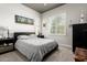 Relaxing bedroom with a gray patterned bedspread and plantation shutters at 5810 E Calle Marita E --, Cave Creek, AZ 85331