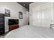 Bedroom with a TV, dresser, and a closet with panel doors at 5810 E Calle Marita E --, Cave Creek, AZ 85331