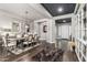 Elegant dining room with hardwood floors, statement lighting, and stylish decor, adjacent to the foyer at 5810 E Calle Marita E --, Cave Creek, AZ 85331