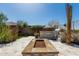 Backyard stone firepit and outdoor grill offer ideal space for relaxation and outdoor entertainment at 5810 E Calle Marita E --, Cave Creek, AZ 85331
