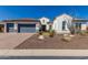 Charming single-story home with a well-manicured front yard featuring desert landscaping and a three-car garage at 5810 E Calle Marita E --, Cave Creek, AZ 85331