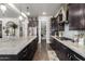 Gorgeous kitchen with large island, stainless steel appliances, pantry, and dark wood cabinetry at 5810 E Calle Marita E --, Cave Creek, AZ 85331