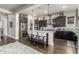 Bright kitchen with a spacious island, stainless steel refrigerator, and dark wood cabinets provides lots of storage space at 5810 E Calle Marita E --, Cave Creek, AZ 85331