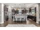 Modern kitchen features stainless steel appliances, a large island with seating, and stylish dark cabinetry at 5810 E Calle Marita E --, Cave Creek, AZ 85331
