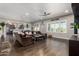 Open-concept living area with hardwood floors, a comfortable sectional, and views of the kitchen at 5810 E Calle Marita E --, Cave Creek, AZ 85331
