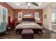 A cozy main bedroom featuring hardwood floors, a king-size bed, and windows offering plenty of natural light at 5810 E Calle Marita E --, Cave Creek, AZ 85331