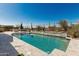 Sparkling backyard pool with baja step and stacked stone wall surrounded by desert landscaping at 5810 E Calle Marita E --, Cave Creek, AZ 85331