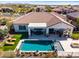 Aerial view of backyard with pool, patio dining, lounge area, artificial turf and desert landscape at 5810 E Calle Marita E --, Cave Creek, AZ 85331
