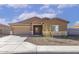 Charming single-story home with a neutral color scheme, xeriscaped yard, and attached two-car garage at 619 W Pintail Dr, Casa Grande, AZ 85122