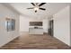 Open-concept living area with a kitchen featuring an island, stainless appliances, and granite countertops at 619 W Pintail Dr, Casa Grande, AZ 85122