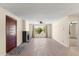 Open living room featuring wood floors, a brick fireplace, and lots of natural light at 6239 N 20Th Dr, Phoenix, AZ 85015