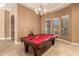 Game room with pool table, billiard lighting, and large window views at 8260 N Buena Vista Dr, Casa Grande, AZ 85194