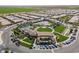 Aerial view of the neighborhood showcasing community amenities, a pool, and recreational areas at 830 E Garden Basket Dr, Queen Creek, AZ 85140