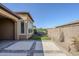 Nicely landscaped backyard featuring a hot tub and hardscape, perfect for relaxation and entertainment at 830 E Garden Basket Dr, Queen Creek, AZ 85140