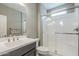 Modern bathroom featuring a glass-door shower, sleek vanity, and neutral color palette at 830 E Garden Basket Dr, Queen Creek, AZ 85140